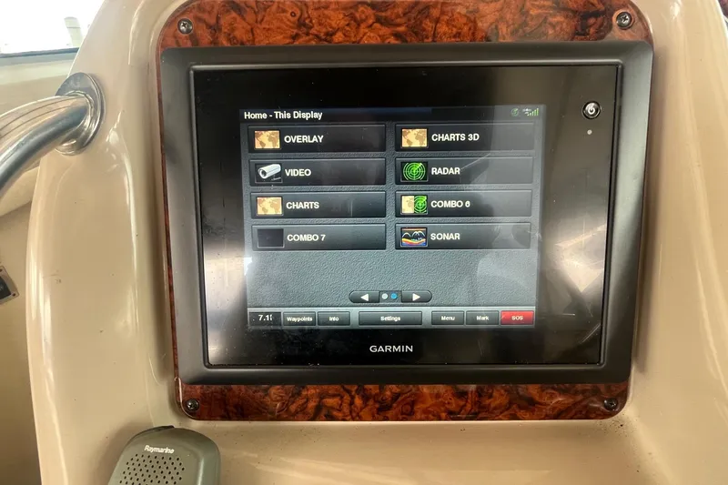 Slide: The Image of Garmin display on 2004 Sea Ray 340 Sundancer showing navigation options. - 16