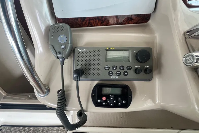 Slide: The Image of Control panel of a 2004 Sea Ray 340 Sundancer with Raymarine and Clarion equipment. - 17