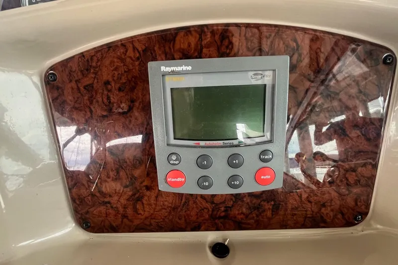 Slide: The Image of Raymarine display on 2004 Sea Ray 340 Sundancer boat dashboard with wood paneling. - 18