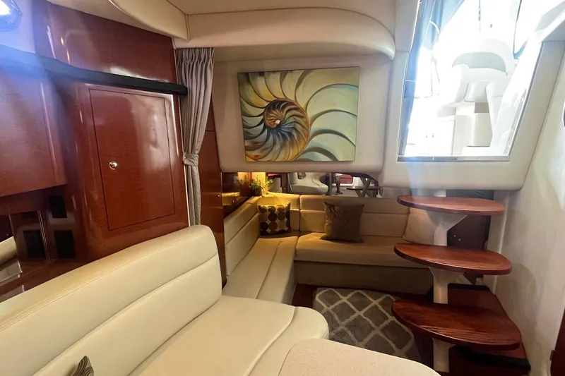 Slide: The Image of Interior of 2004 Sea Ray 340 Sundancer with elegant seating and modern decor. - 22