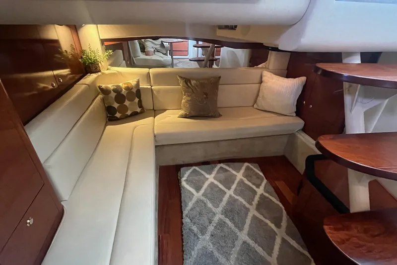 Slide: The Image of Luxurious interior of 2004 Sea Ray 340 Sundancer yacht with cozy seating and elegant decor. - 29