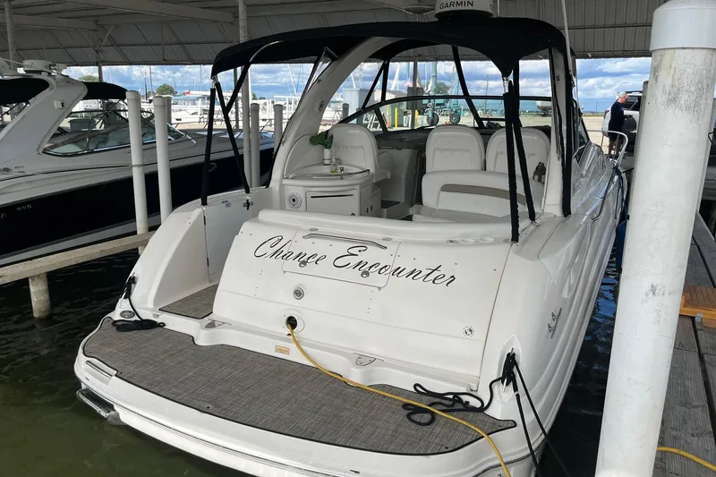Slide: The Image of 2004 Sea Ray 340 Sundancer docked, featuring "Chance Encounter" on the stern. - 3