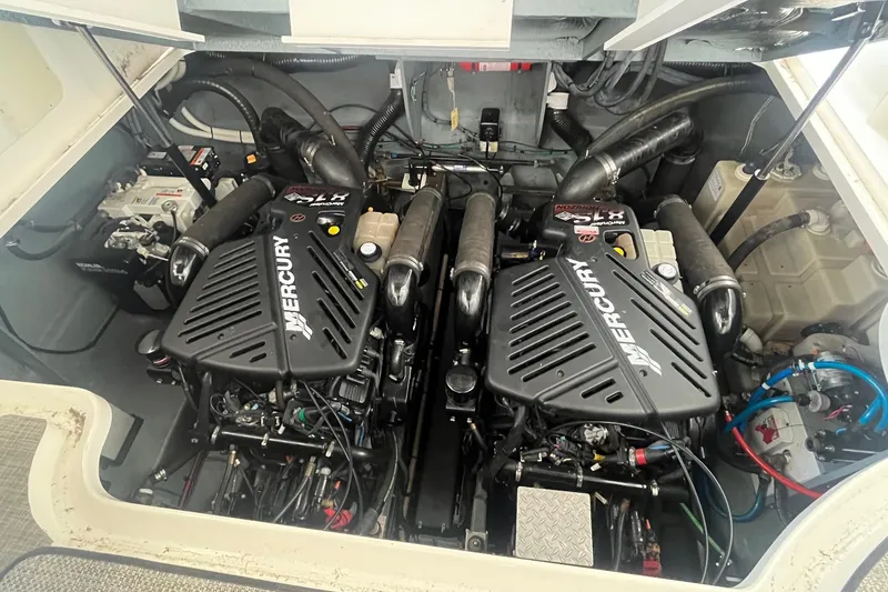 Slide: The Image of Engine compartment of 2004 Sea Ray 340 Sundancer with twin Mercury engines. - 31
