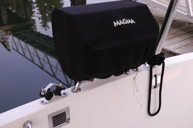 Slide: The Image of Covered Magma grill on 2013 American Tug 395 boat deck by the water. - 111