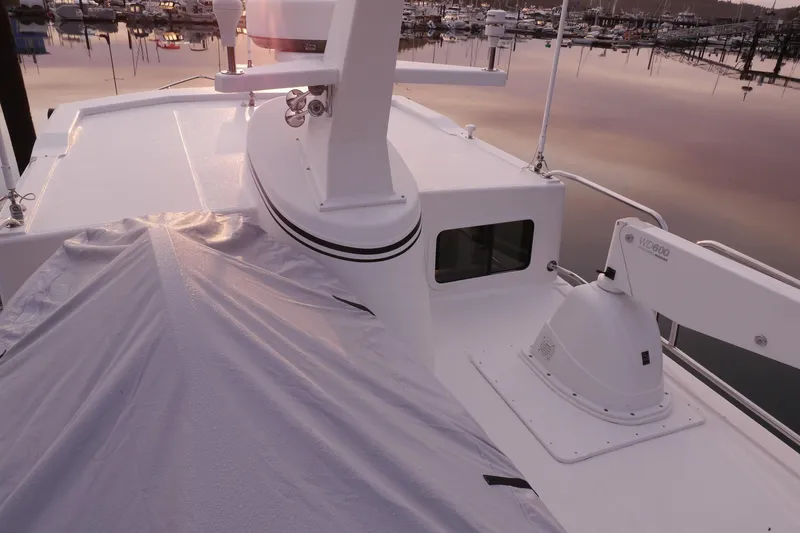 Slide: The Image of American Tug 395, 2013 model, docked at marina during serene sunset. - 117