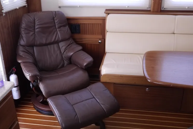 Slide: The Image of Luxurious interior of 2013 American Tug 395 with leather chair and wooden accents. - 15