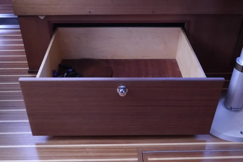 Slide: The Image of Open wooden drawer on American Tug 395, 2013 model, with striped flooring. - 19