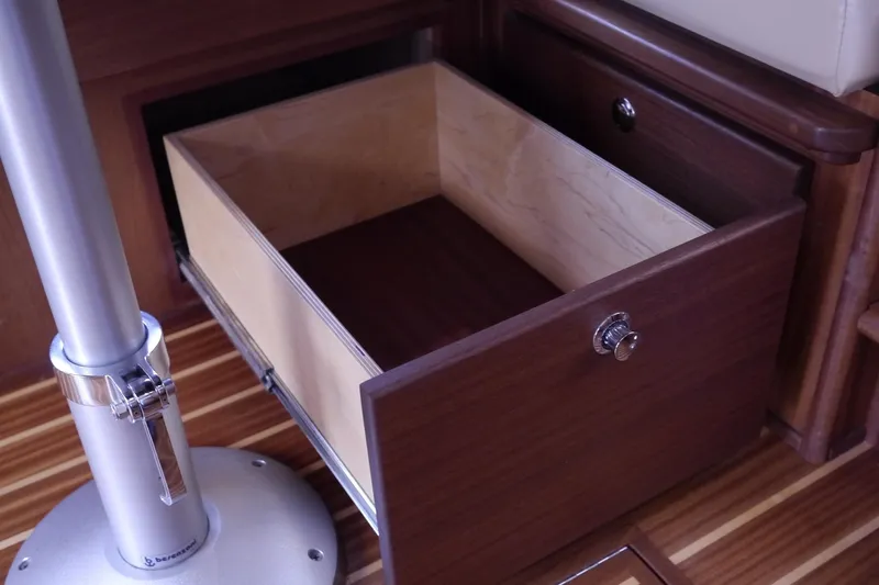 Slide: The Image of Open wooden drawer in 2013 American Tug 395 interior, showcasing storage space. - 20