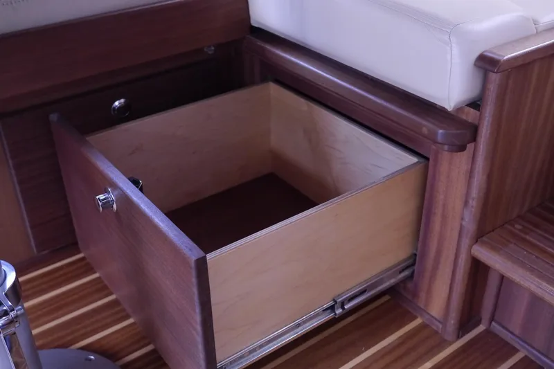 Slide: The Image of Open wooden storage drawer in 2013 American Tug 395 boat interior. - 21