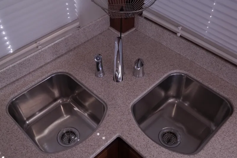 Slide: The Image of Dual stainless steel sinks in 2013 American Tug 395 kitchen with granite countertop. - 29