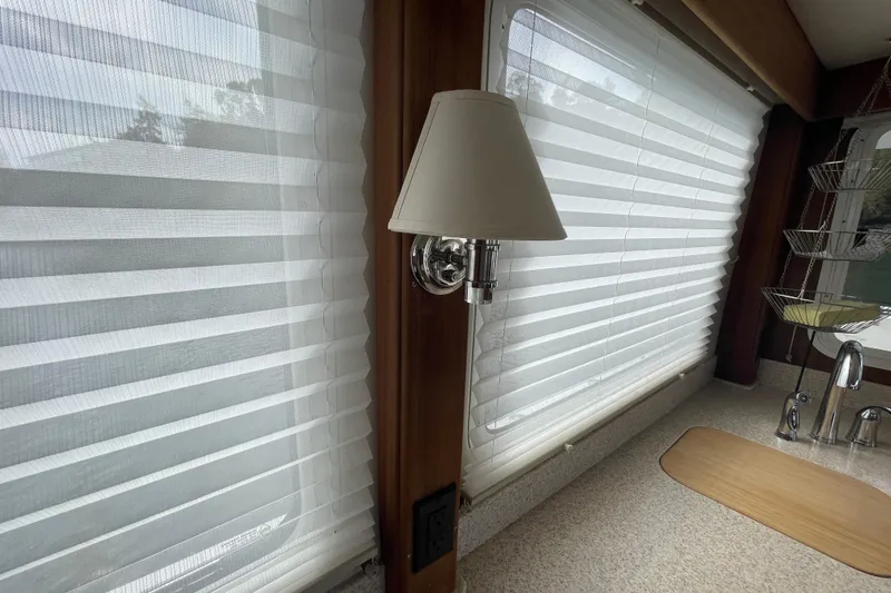 Slide: The Image of Interior of 2013 American Tug 395 with window blinds and wall lamp. - 32