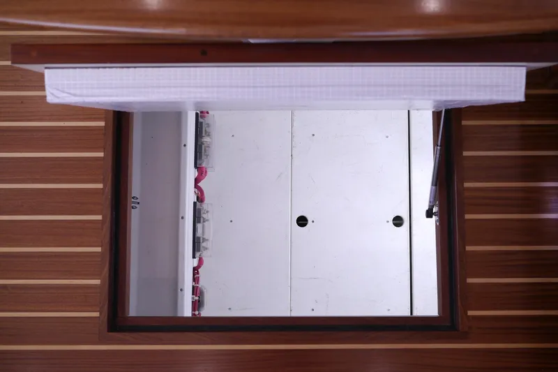 Slide: The Image of Engine compartment access hatch on 2013 American Tug 395, featuring wooden flooring. - 33