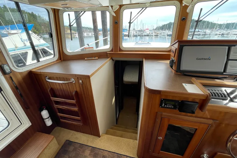 Slide: The Image of Interior of 2013 American Tug 395 with navigation equipment and cabin access. - 34