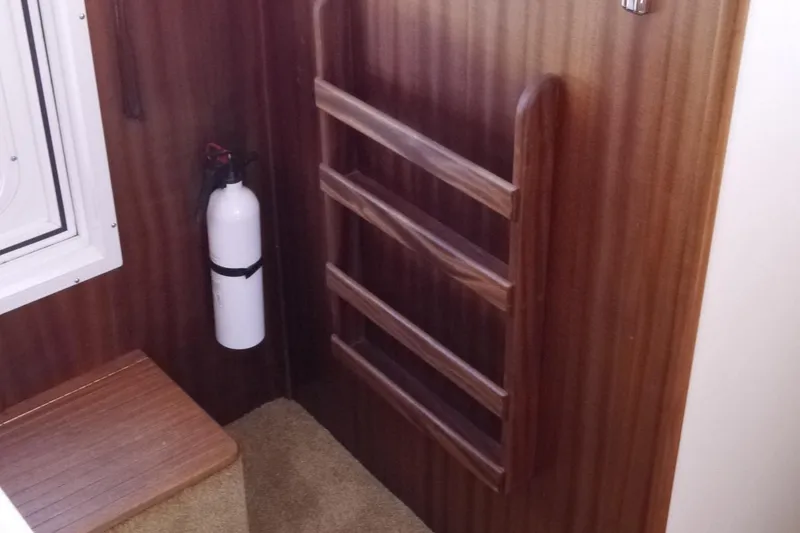 Slide: The Image of Interior of 2013 American Tug 395 with wooden ladder and fire extinguisher. - 42