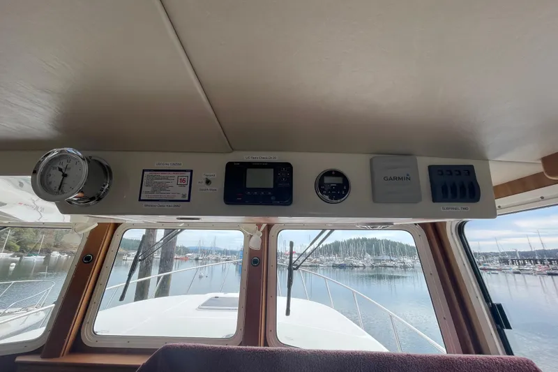 Slide: The Image of Interior view of 2013 American Tug 395 dashboard with navigation instruments. - 43