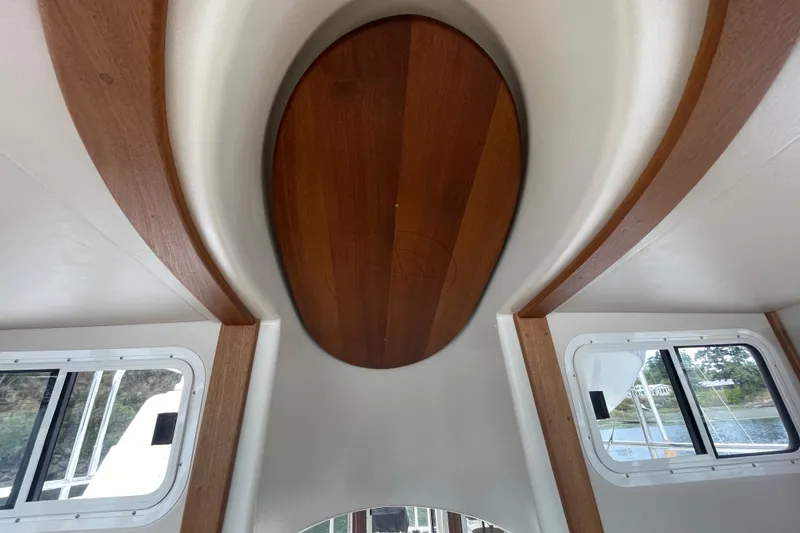 Slide: The Image of Interior view of 2013 American Tug 395 with wooden ceiling detail and windows. - 57