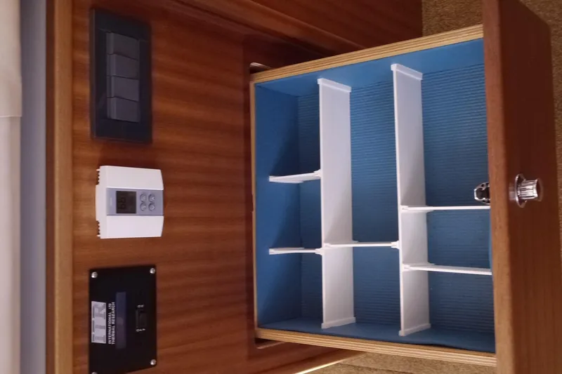 Slide: The Image of Interior of 2013 American Tug 395 with organized storage compartments and control panels. - 60