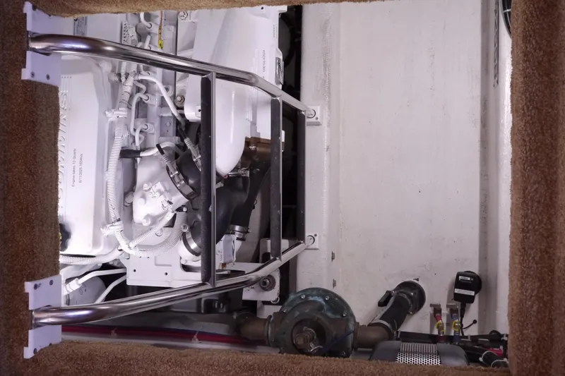 Slide: The Image of Engine room of a 2013 American Tug 395 with visible machinery and components. - 61