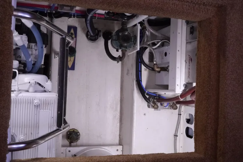 Slide: The Image of Engine room of 2013 American Tug 395 with visible machinery and piping. - 62