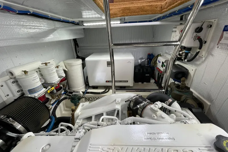 Slide: The Image of Engine room of 2013 American Tug 395, featuring modern equipment and organized layout. - 63