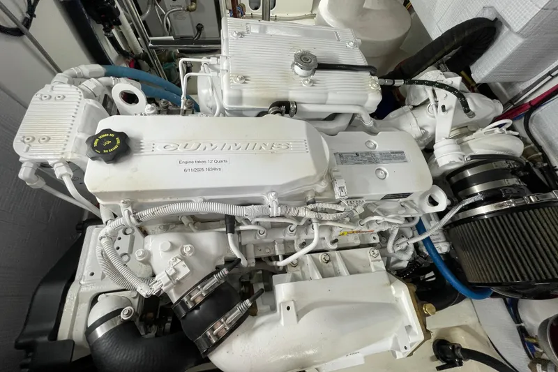 Slide: The Image of Engine of 2013 American Tug 395, featuring a Cummins diesel engine. - 66