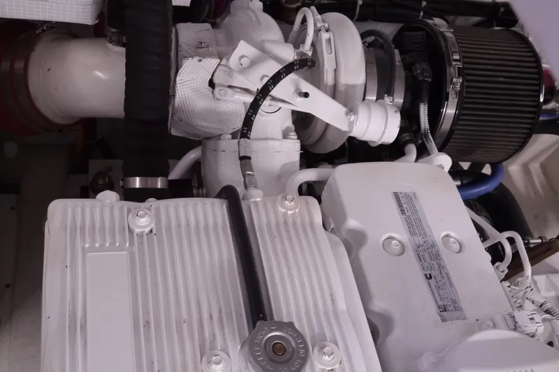 Slide: The Image of Engine components of a 2013 American Tug 395, showcasing intricate mechanical details. - 67