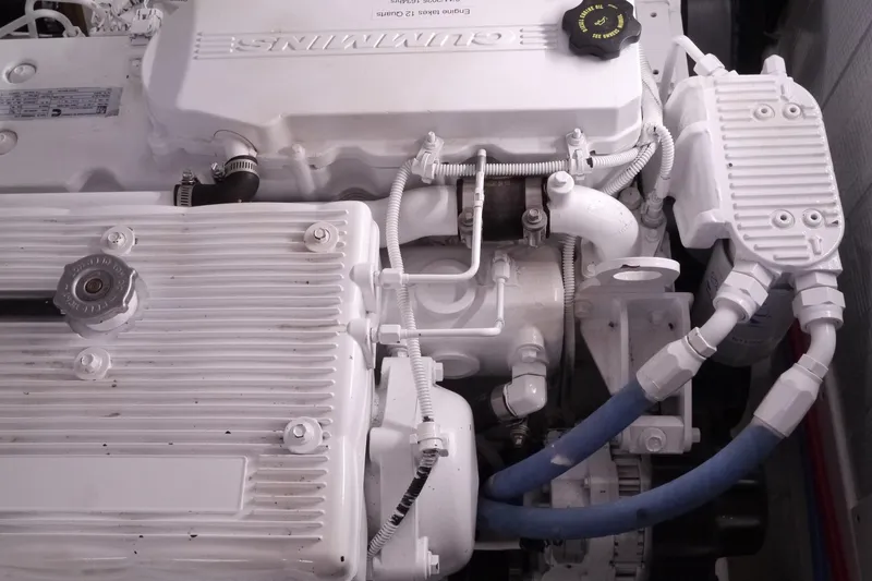 Slide: The Image of Engine compartment of a 2013 American Tug 395, featuring detailed mechanical components. - 68