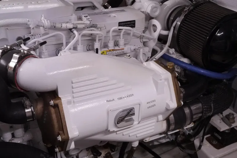 Slide: The Image of Engine compartment of a 2013 American Tug 395, showcasing detailed mechanical components. - 69