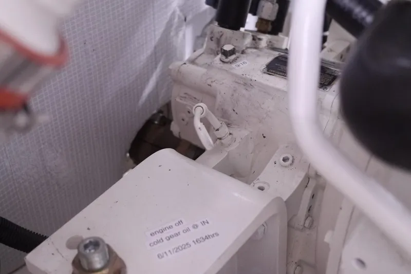 Slide: The Image of Engine compartment of a 2013 American Tug 395, showing mechanical components and labels. - 70