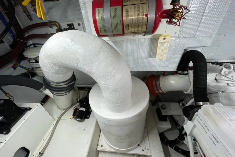 Slide: The Image of Engine room of 2013 American Tug 395 with exhaust system and fire extinguisher. - 75
