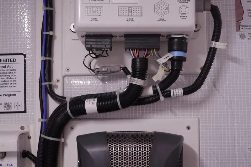 Slide: The Image of Electrical wiring and control panel inside a 2013 American Tug 395 boat. - 81