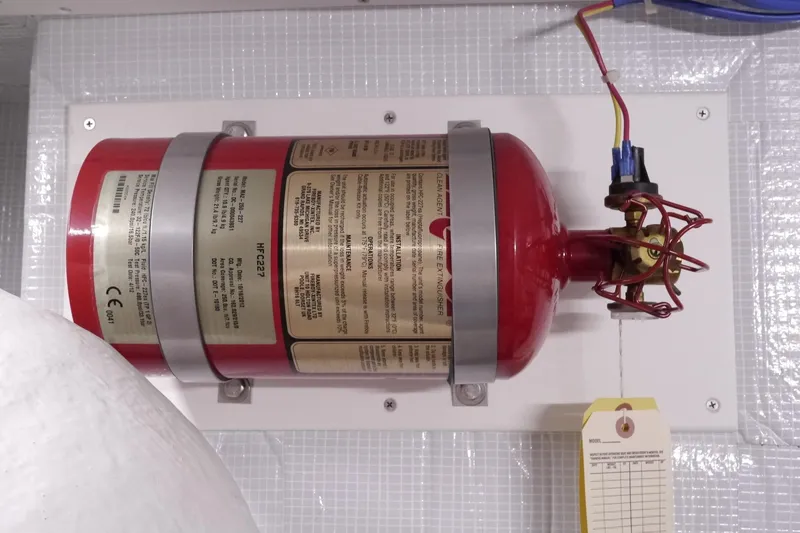 Slide: The Image of Fire extinguisher mounted on 2013 American Tug 395 boat, featuring HFC-227 clean agent system. - 82