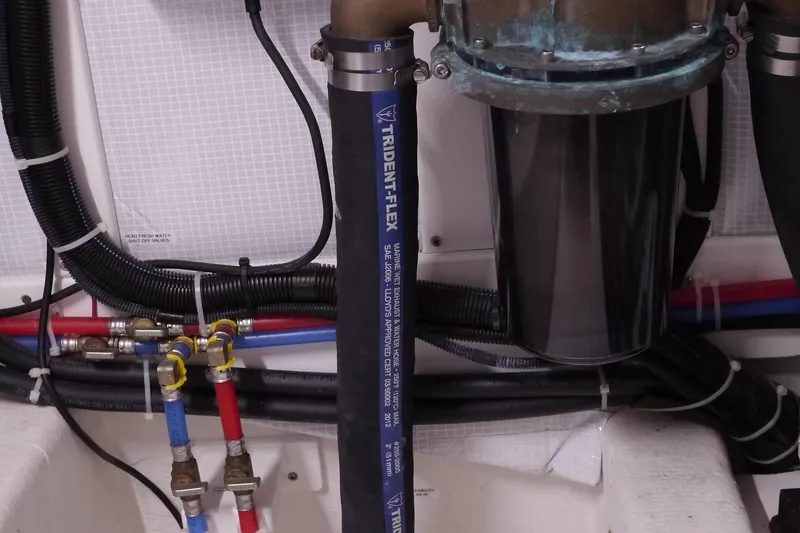 Slide: The Image of Engine room plumbing of 2013 American Tug 395 with Trident-Flex hose and valves. - 83