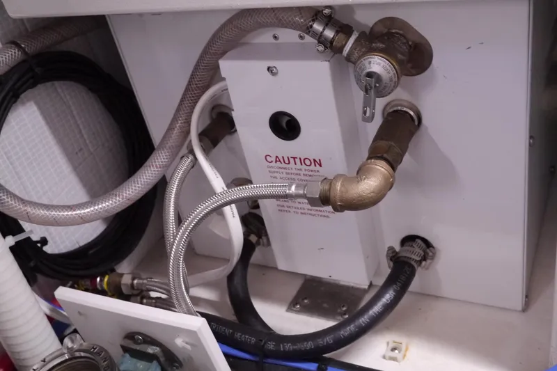 Slide: The Image of Engine room piping and connections in a 2013 American Tug 395 boat. - 84