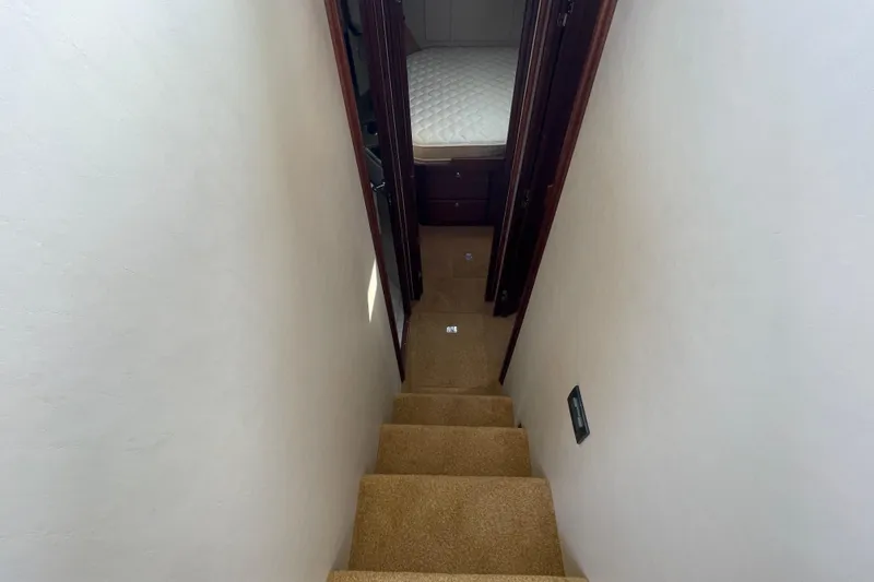 Slide: The Image of Staircase leading to cabin in 2013 American Tug 395 boat interior. - 85