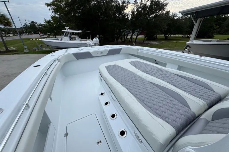 Slide: The Image of 2026 Invincible 38 Catamaran with spacious deck and luxurious seating. - 20