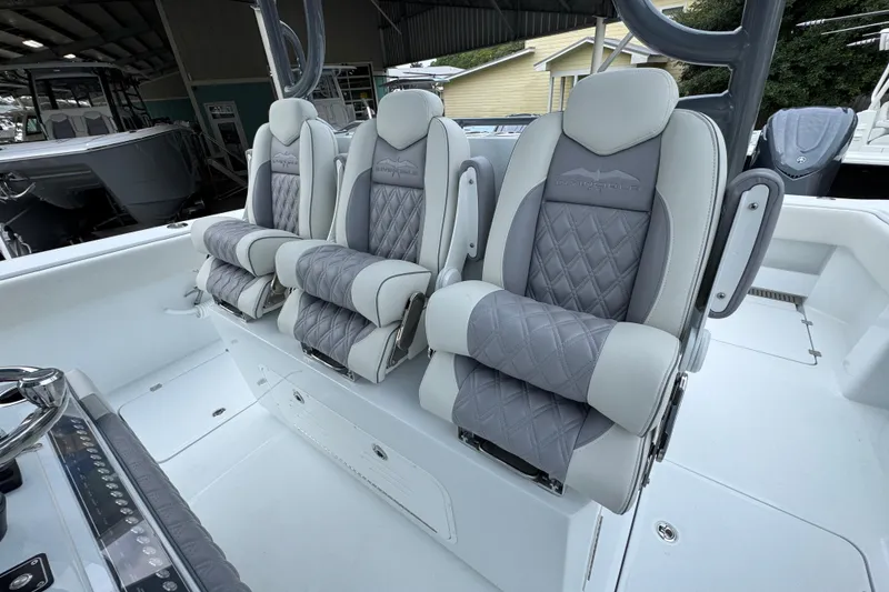Slide: The Image of Luxurious seating on 2026 Invincible 38 Catamaran, featuring elegant gray upholstery and ergonomic design. - 28
