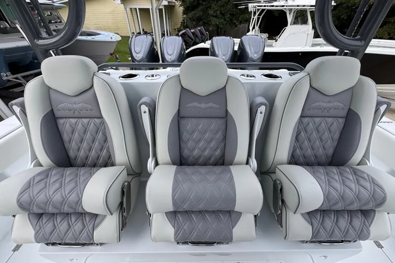 Slide: The Image of Luxurious seating on 2026 Invincible 38 Catamaran, featuring elegant gray upholstery and diamond stitching. - 29
