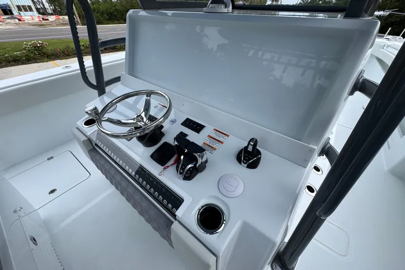 Slide: The Image of Helm of 2026 Invincible 38 Catamaran with steering wheel and controls. - 34