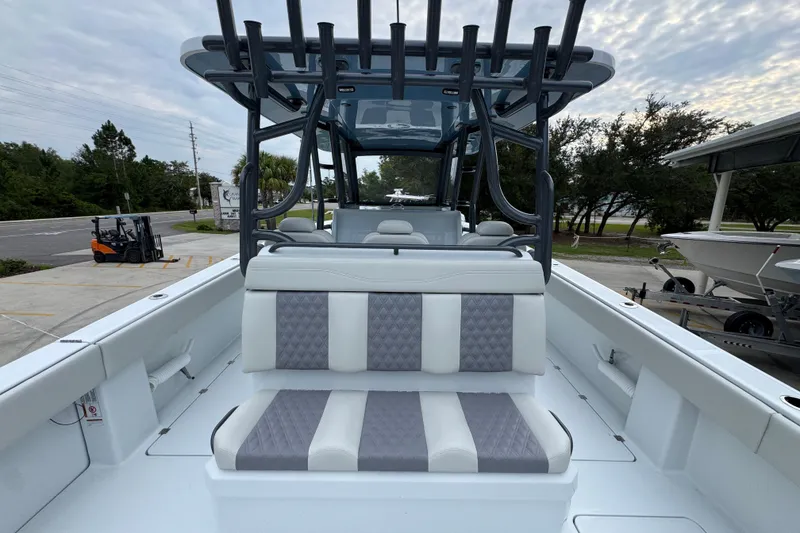 Slide: The Image of 2026 Invincible 38 Catamaran with sleek seating and modern design in a marina setting. - 37