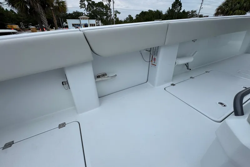 Slide: The Image of 2026 Invincible 38 Catamaran interior with sleek white deck and storage compartments. - 38