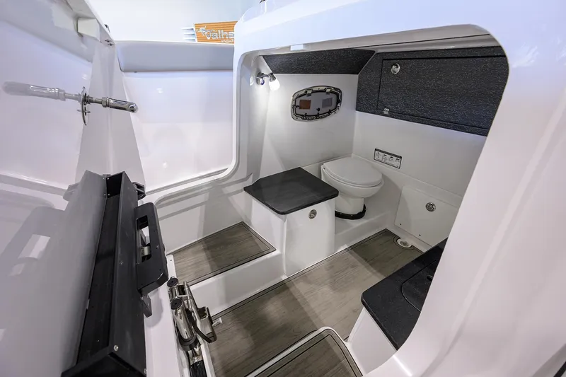 Slide: The Image of 2026 Monterey Elite 25 OB boat interior with modern bathroom amenities. - 10