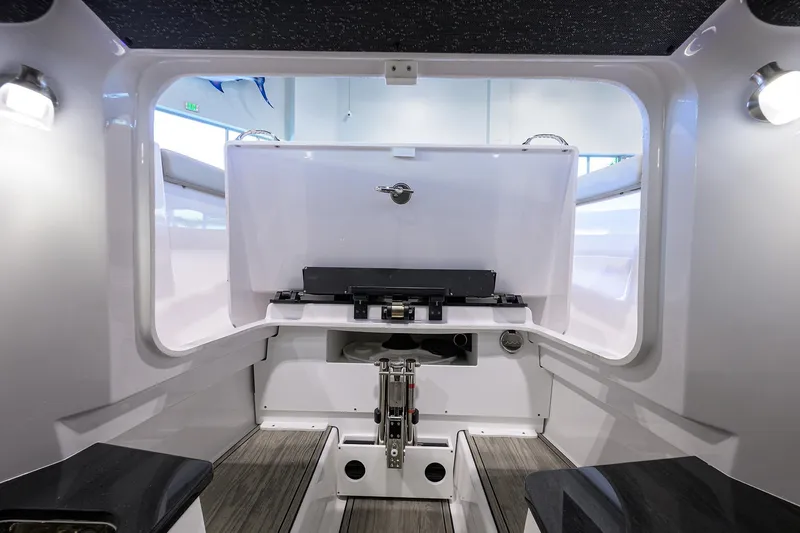 Slide: The Image of Interior of 2026 Monterey Elite 25 OB boat, featuring sleek design and modern amenities. - 15