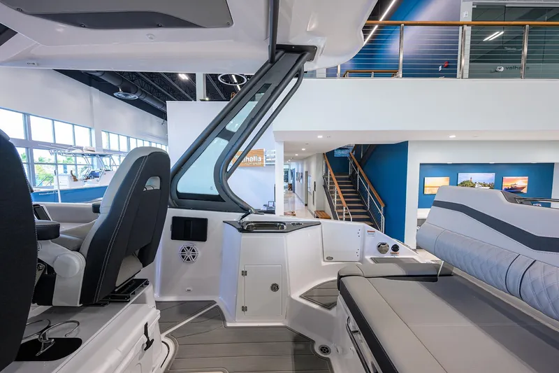 Slide: The Image of Interior of 2026 Monterey Elite 25 OB boat, showcasing seating and helm area. - 19