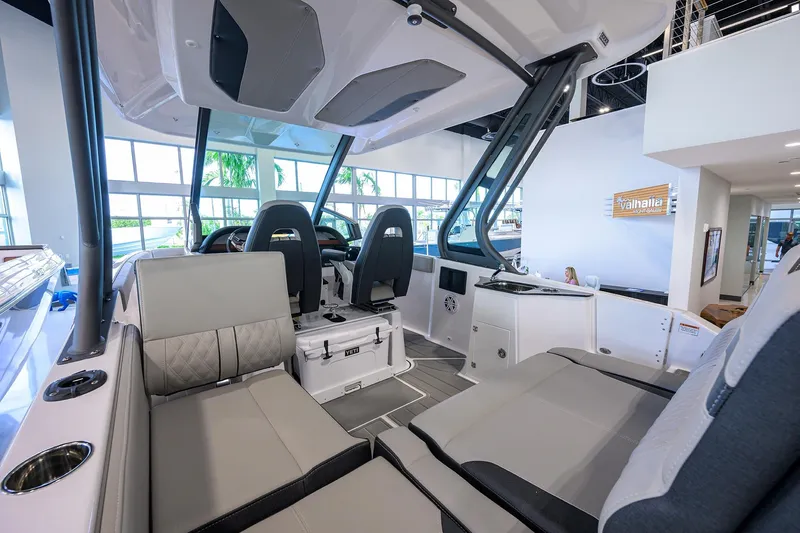 Slide: The Image of Interior of 2026 Monterey Elite 25 OB boat with modern seating and dashboard. - 28