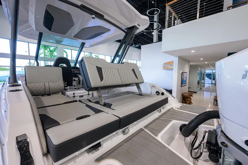 Slide: The Image of 2026 Monterey Elite 25 OB boat interior with modern seating and sleek design. - 30