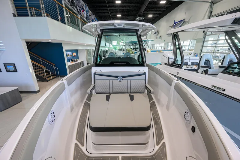 Slide: The Image of 2026 Monterey Elite 25 OB boat interior with modern seating and sleek design. - 4