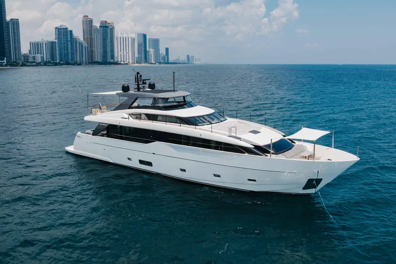 Slide: The Image of Luxurious 2024 Sanlorenzo SL90A yacht cruising near a city skyline. - 11