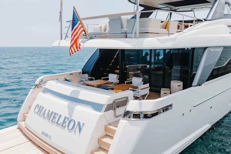 Slide: The Image of 2024 Sanlorenzo SL90A luxury yacht "Chameleon" docked at sea, featuring elegant outdoor seating. - 17