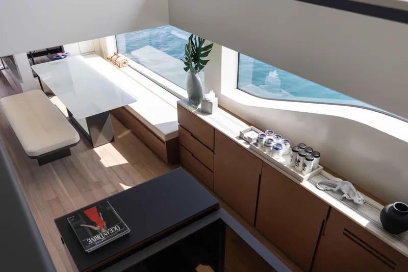 Slide: The Image of Luxurious interior of 2024 Sanlorenzo SL90A yacht with modern dining area and ocean view. - 32